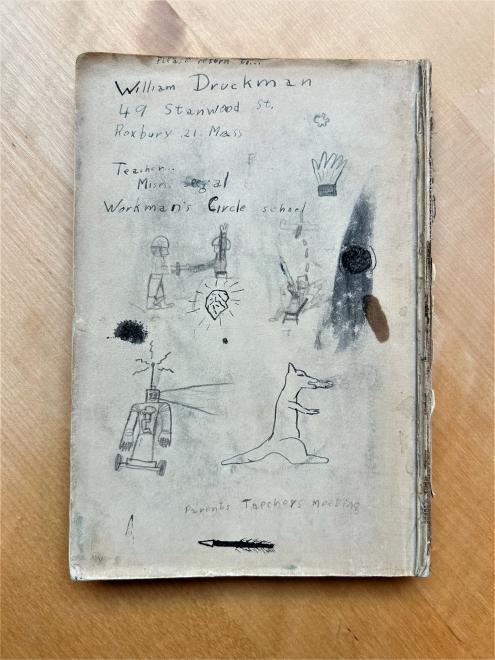 Cover page of a doodle-covered Yiddish book.