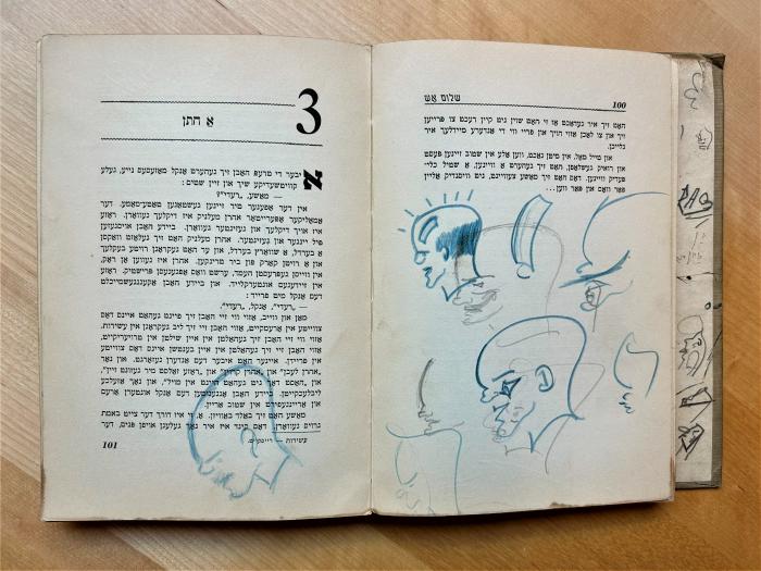 Doodle-covered page in a Yiddish book.
