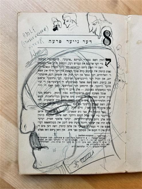 Yiddish book with a doodle of Adolf Hitler.