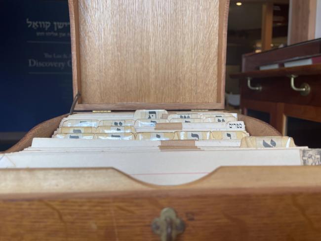 Close up of the index cards in the card catalogue, which are sorted alphabetically and labeled with Yiddish letters
