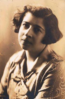 Sepia portrait of a woman wearing a patterned top
