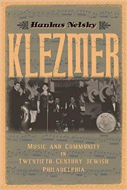Book cover with a black and white photograph of a band on stage 