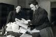 Abraham Sutzkever and his wife Freyde in their Moscow apartment in March 1944 surveying materials they rescued from Vilna