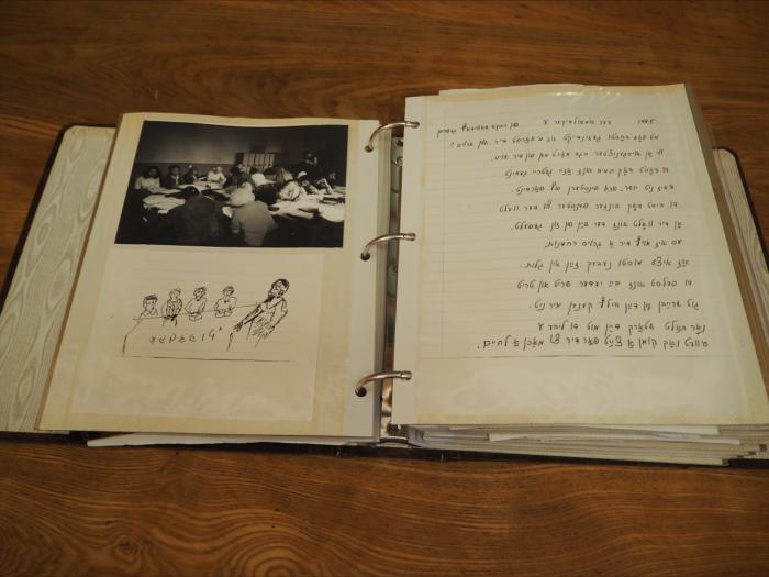 A picture of Rokhl's scrapbook. On the top left, a black and white photo of students in the classroom, including Rokhl. Bottom left, a sketch of the classroom. On the right is a handwritten page of Yiddish. 