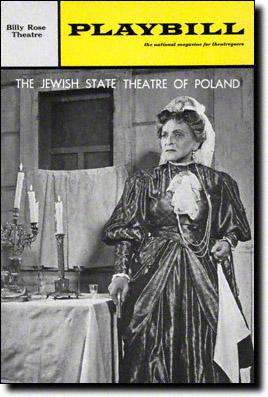 Playbill cover of Ida Kaminska starring in "Mirele Efros" wearing a gown and standing beside a Shabbat table
