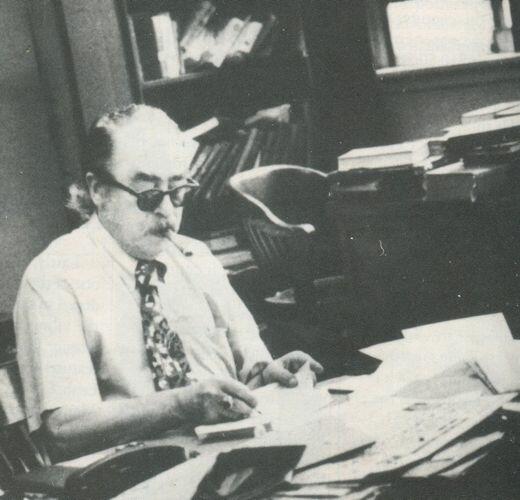 Yiddish poet Meyer Shtiker at his office at the Jewish Daily Forward. Photograph by Arnold Chekow.