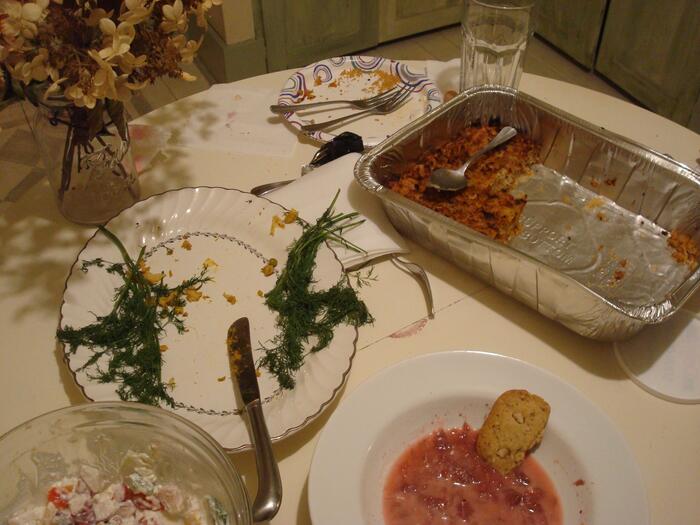 Aftermath of a feast, with leftover cheese pudding, strawberry borscht, cookies, farmer's salad.