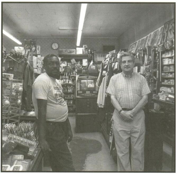 Robert Hirsberg and Marvin Joe Sawyer in Hirsberg's drugstore, Friar's Point, surrounded by merchandise