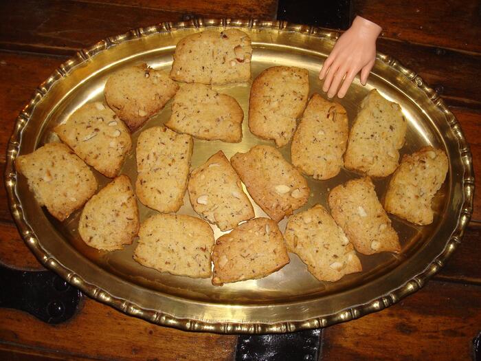 Ice box cookies on a golden platter with toy hand.