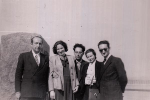 Black and white photo of five individuals. 