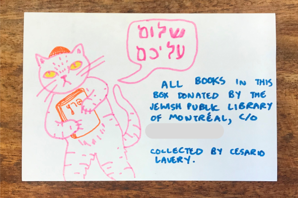 A marker drawing of a cat clutching a Yiddish book saying "Shalom Aleichem" 