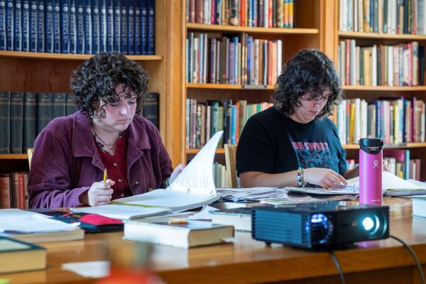 Two students study their Yiddish notes